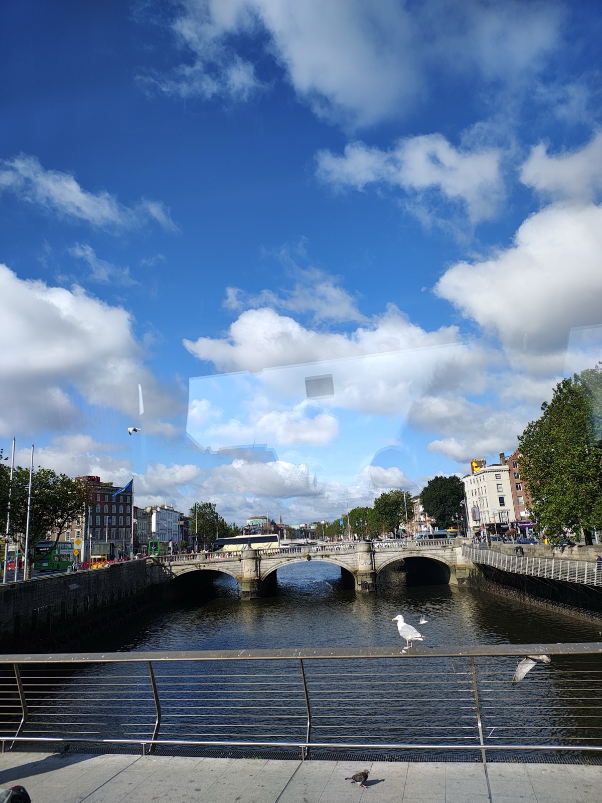 A bridge over the River Liffey in Dublin under a bright blue sky