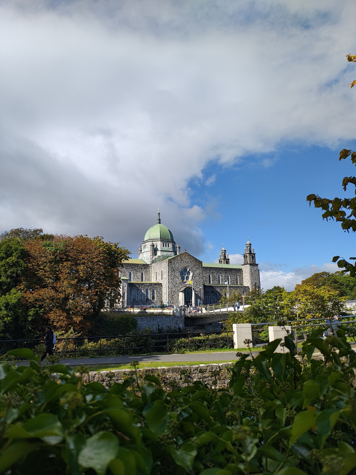 Galway Cathedral with its green dome under a partly cloudy sky